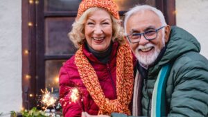 An older couple joyfully celebrating the New Year with sparklers, symbolizing a well-planned and secure retirement. Ballentine Capital Advisors, a trusted wealth management firm in Greenville, SC, helps retirees achieve financial confidence and enjoy their next chapter.