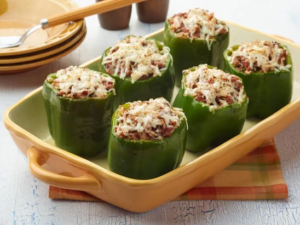 A plate of freshly made stuffed peppers, highlighting a nutritious and budget-friendly meal option as part of a smart financial and retirement planning lifestyle.