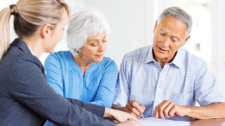 Clients meeting with a financial advisor, reviewing investment plans and market strategies for long-term financial success.