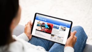 newspaper with headlines and market graphs, symbolizing current financial news and investment updates.