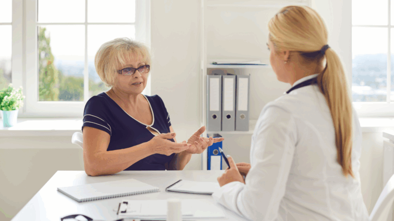 Woman meeting with her doctor to discuss retirement healthcare options, representing the importance of proactive Medicare planning and long-term care strategies with guidance from BCA Private Wealth.
