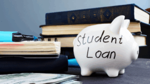 Piggy bank marked student loan showing importance of repaying loans to create and maintain good credit