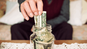 Savings jar with cash illustrating responsible money management and steps to build credit