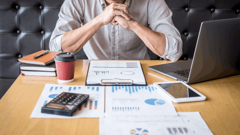 Man reviewing financial documents, symbolizing how the GENIUS Act may impact personal investments and planning strategies – BCA Private Wealth