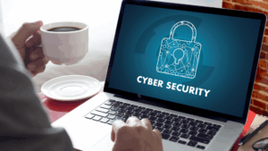Laptop screen displaying the word cybersecurity, emphasizing digital protection, fraud prevention, and secure financial planning.